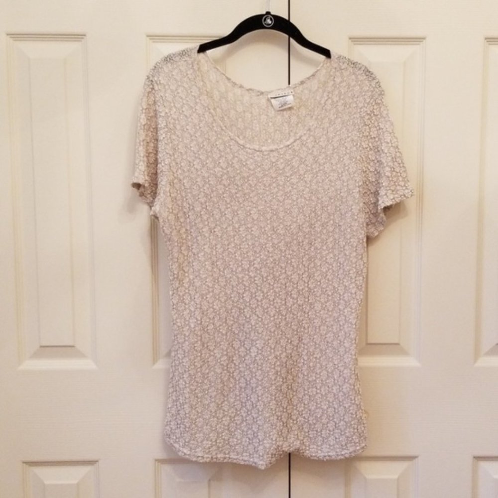Cream colored sheer top.